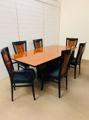 A contemporary Kesterport dining table with four chairs and two carvers (H 76cm x L 200cm x W
