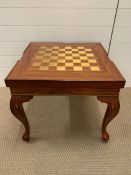 A square games table on cabriole legs (H50cm W56cm)