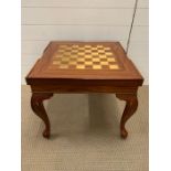 A square games table on cabriole legs (H50cm W56cm)