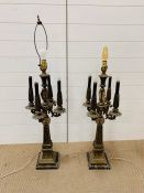 A pair of ornate brass and ormolu four arm candleabra on marble base (one arm AF)