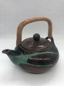 A Poh Chap Yeap (1927 - 2007) Pottery Teapot (H15cm)Condition Report There is a chip to the spout.