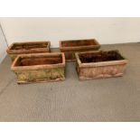 Four terracotta garden troughs with tree themed (H25cm W60cm D30cm)