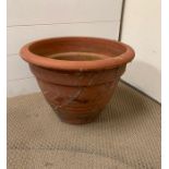 A terracotta plant pot (H30cm Dia 44cm)