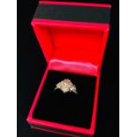 A White Gold Diamond Cluster Ring. Size M