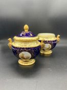 A pair of Coalport lidded pots