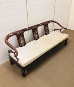 A Chinese two seater sofa with mother of pearl design. (H76cm D60cm W171cm)