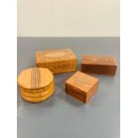 Four wooden carved desk top boxes, two with brass inlay