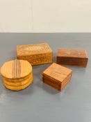 Four wooden carved desk top boxes, two with brass inlay