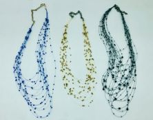 Three delicate multi stranded beaded necklaces