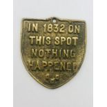 A brass plaque "In 1832 on this spot nothing happened"