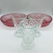 Two decorative rose coloured glass shallow bowls and three pretty sundae glasses
