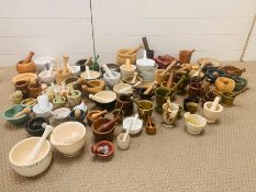 A large collection of pestle and mortars