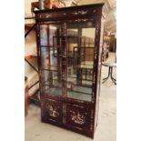 A Chinese display cabinet with mother of pearl design. (H198cm D39cm W106cm)