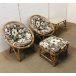 A pair of Bamboo framed hoop chairs with cushions and matching footstool and side table