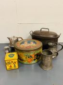 A selection of food and drink vintage related items, cake tin, tea tin and pewter jugs along with