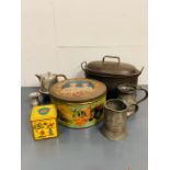 A selection of food and drink vintage related items, cake tin, tea tin and pewter jugs along with