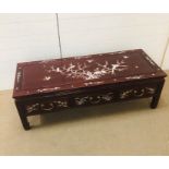 A Low Chinese coffee table with mother of pearl design. (H42cm W128cm D50cm)