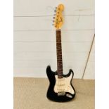 A Squier Fender electric bullet Strat guitar