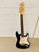 A Squier Fender electric bullet Strat guitar