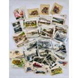 A Selection of cigarette and tea cards, mainly of the photographic style.