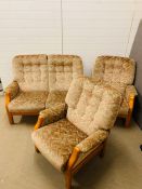 A mid-century two seater sofa and two armchairs