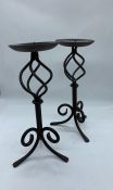 A pair of metal candlestick holders