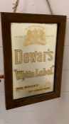 A Dewars 'White Label' mirror by Warrant to H.M The King.