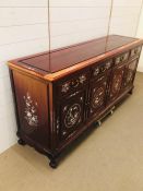Large Chinese sideboard with mother of pearl design. (H84cm D49cm W182cm)
