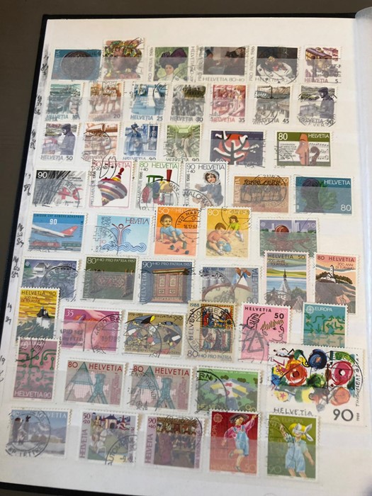 A worldwide album of stamps to include Helvetia, San Marino, Tadzikistan, Turkmenistan, Vatican,