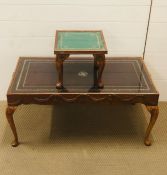 Two drinks tables with embossed leather under glass top with decorated cabriole legs and raised