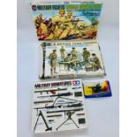A selection of military model kits to include British Tank Troops, German Afrika Korps and U.S