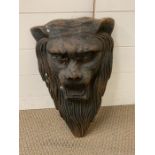A cast iron wall hanging sculpture of a lions head maybe Victorian