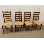 Four ladder back dining chairs