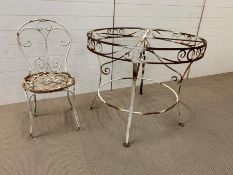 Salvaged scroll work circular table and metal work chair with lattice seat
