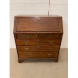 A mahogany bureau, the front opens to reveal fitted drawers (H103cm W92cm D52cm)