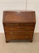A mahogany bureau, the front opens to reveal fitted drawers (H103cm W92cm D52cm)