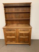 Pine dresser with open rack over two drawers and two door cupboard (H180cm W124cm D46cm)