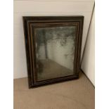 A ebony cushion mirror retaining the original mercury glass plate 100cm x 80xm