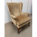 Parker Knoll wing back chair in gold fabric (H97cm)