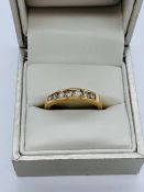 A 9ct gold eternity style diamond ring. Size N
