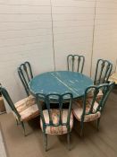 A shabby sheek circular table with six chairs