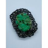 An Oriental Jade Brooch