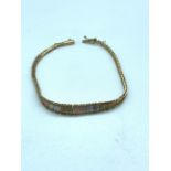 A Three Colour 9 ct gold bracelet (4.9g)