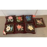 A Selection of Eight needlepoint cushions worked with flowers these are from The Duarte Pinto Coelho