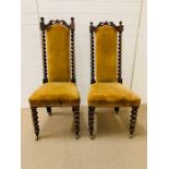 A Pair of Victorian Hall Chairs with castors and Barley twist backs.