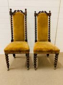 A Pair of Victorian Hall Chairs with castors and Barley twist backs.