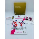 A London 2012 50 pence Sports Collection Set along with a 2012 Olympic Badge and Stamps