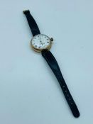 A 9 ct gold Waltham Vintage Watch on a leather strap