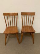 A pair of pine kitchen chairs