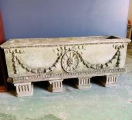 Re-pressed stone planter with crowns and swags on Doric column decorated feet (H35cm D35cm W122cm)